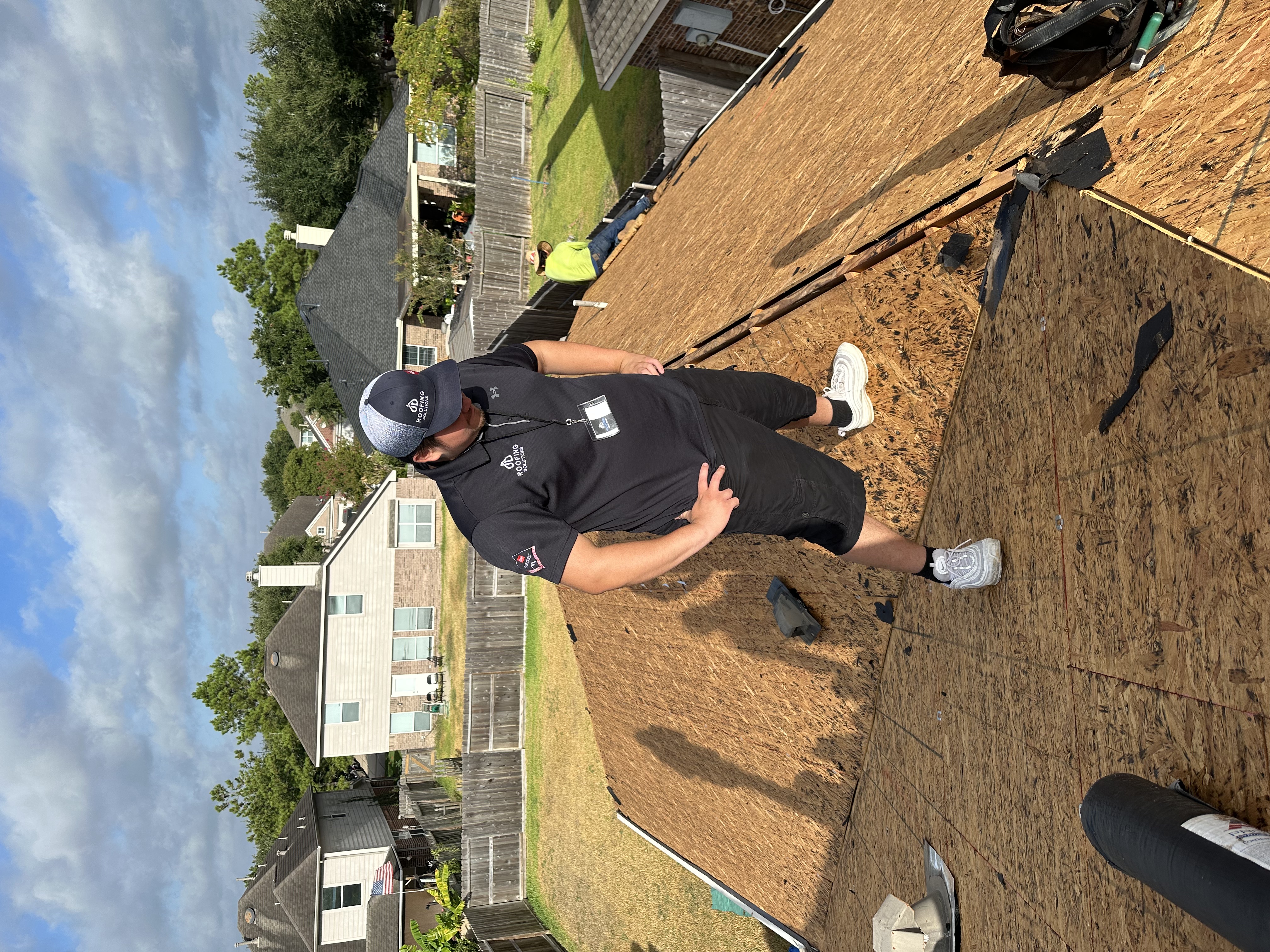 JD Roofing Solutions crew member on the job